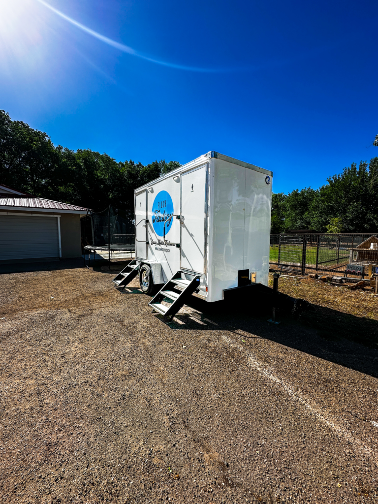 Restroom trailer set up at a backyard party in Albuquerque