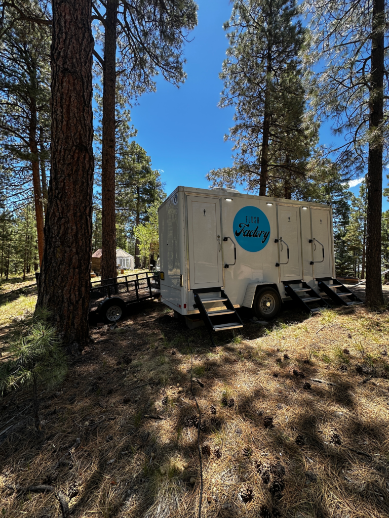 Luxury restroom trailer at a forest wedding venue in New Mexico