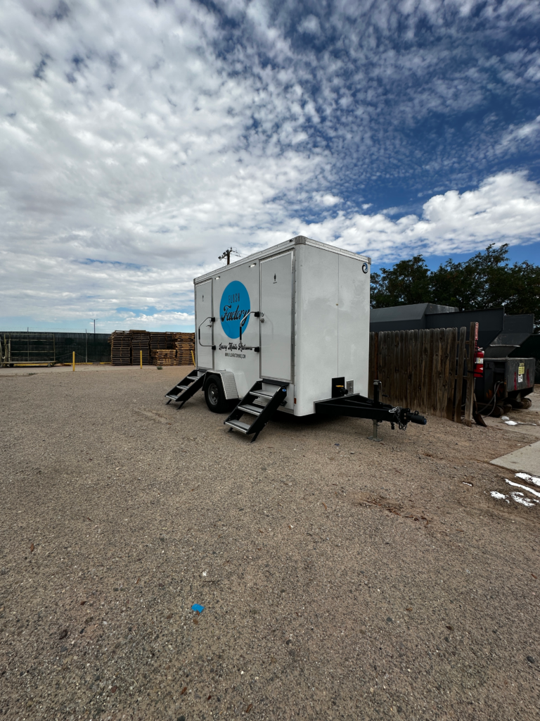 Portable restroom trailer set up for an outdoor event in Albuquerque