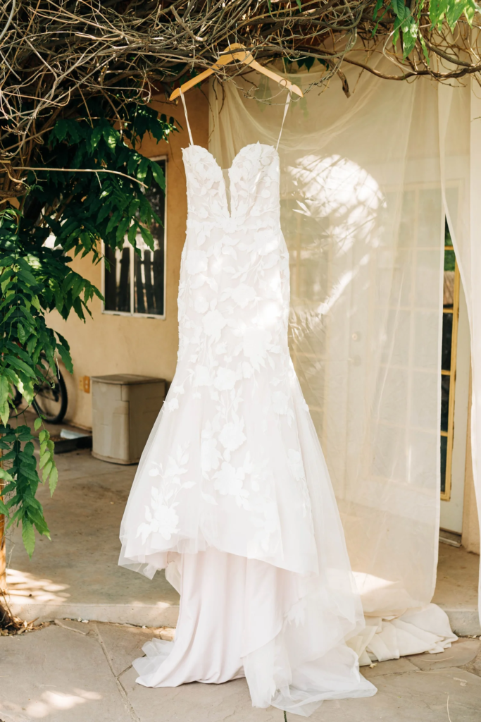 Wedding dress hanging outdoors at a New Mexico wedding venue